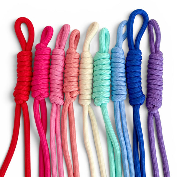 Seven braided cord loops in assorted colors including red, pink, peach, cream, mint, light blue, royal blue, and purple, arranged vertically on a white background.