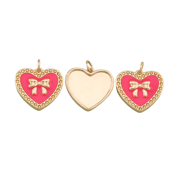 Three heart-shaped pendants with pink backgrounds and gold accents on a white background
