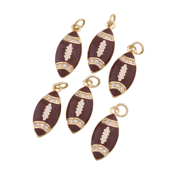Five football-shaped jewelry charms with cubic zirconias on a white background