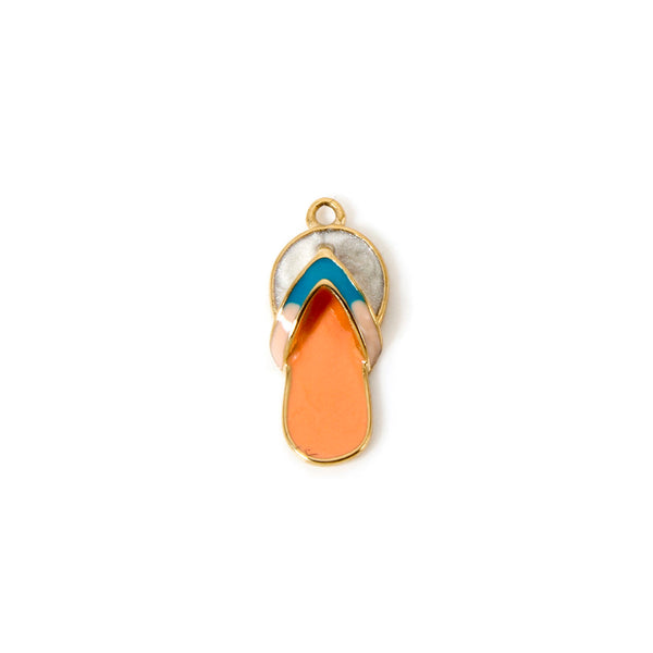 Flip-flop sandal charm with gold, blue, and orange design on a white background