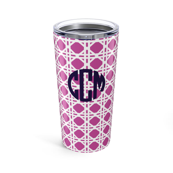 Tumbler with pink rattan caning pattern and navy monogram on a white background