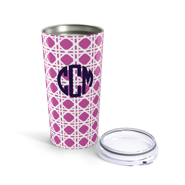 Tumbler with pink rattan caning pattern and navy monogram on a white background