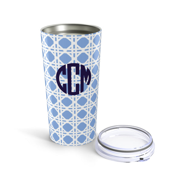 Tumbler with light blue rattan caning pattern and navy monogram on a white background