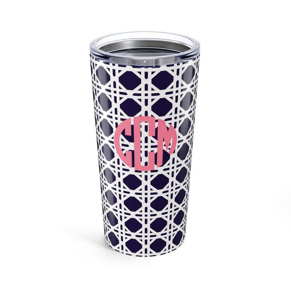 Tumbler with navy rattan caning pattern and pink monogram on a white background