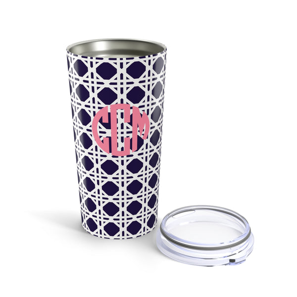 Tumbler with navy rattan caning pattern and pink monogram on a white background