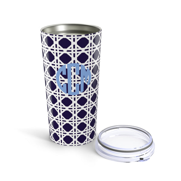 Tumbler with navy rattan caning pattern and light blue monogram on a white background