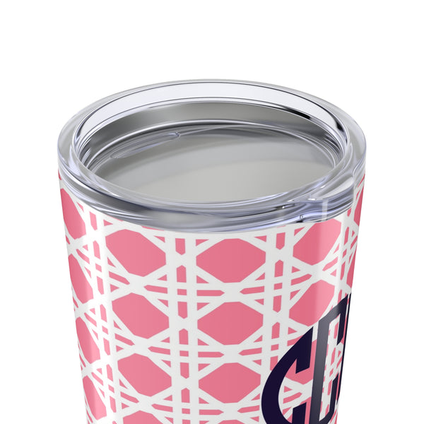 Tumbler with light pink rattan caning pattern and navy monogram on a white background