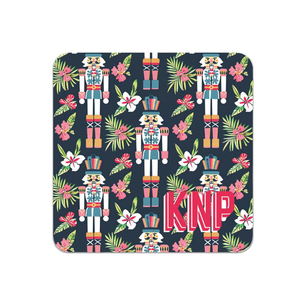 Navy coaster with colorful nutcracker design and 'KNP' initials