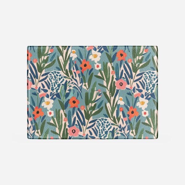 Floral and animal patterned cutting board on a white background