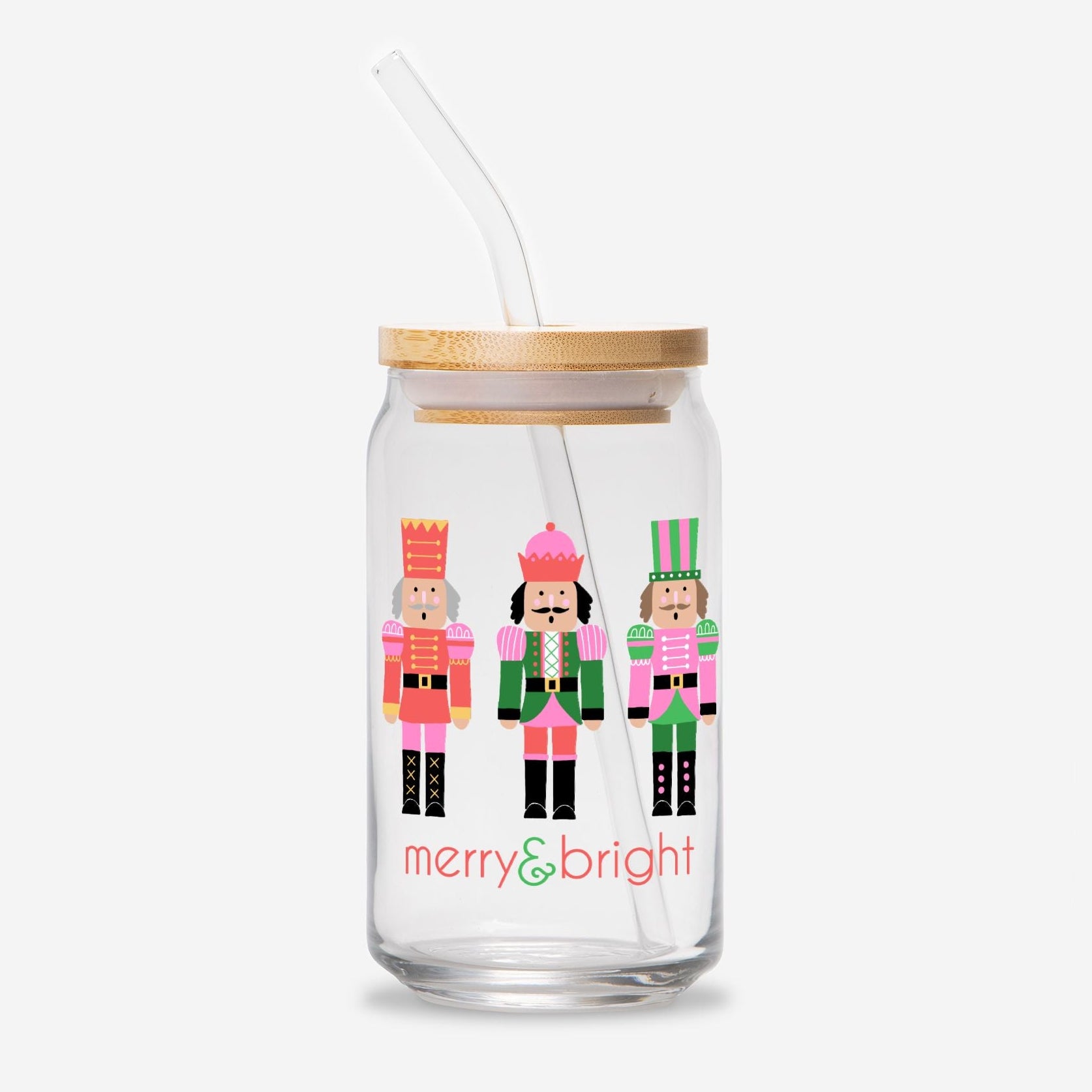 Glass tumbler with nutcracker design and 'merry & bright' text on a white background