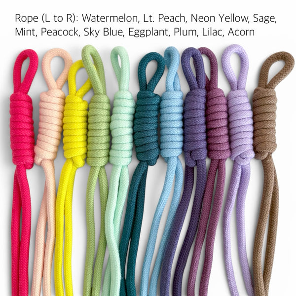 Nine braided rope cords in different pastel and bright colors arranged side by side on a white background, with text at the top listing the color names from left to right.