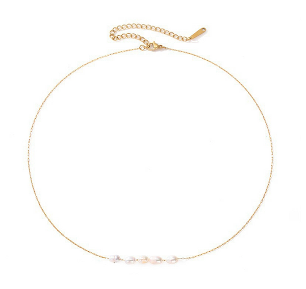 A delicate gold chain necklace with five small white baroque pearls aligned horizontally at the center, displayed on a clean white background.