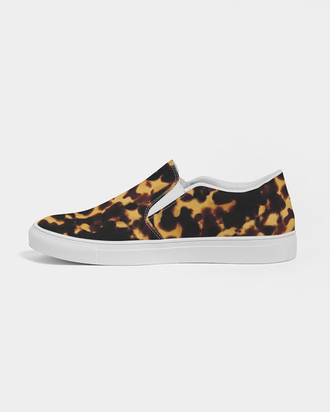 Tortoiseshell patterned slip-on sneaker with white sole on a light gray background