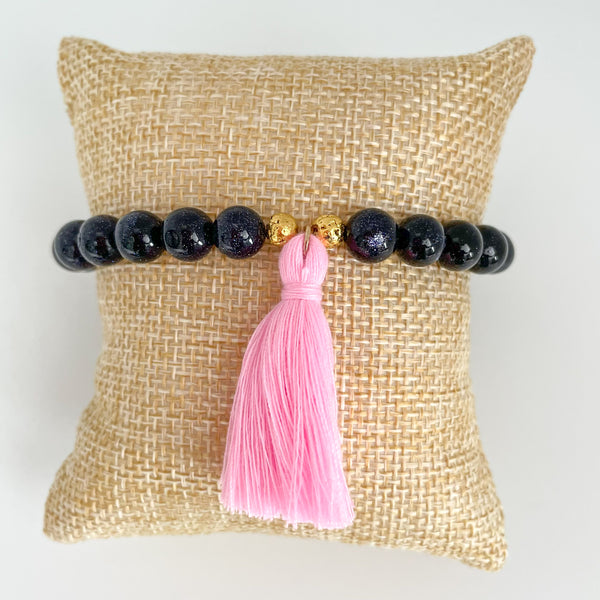 handmade goldstone bracelet with pink tassel