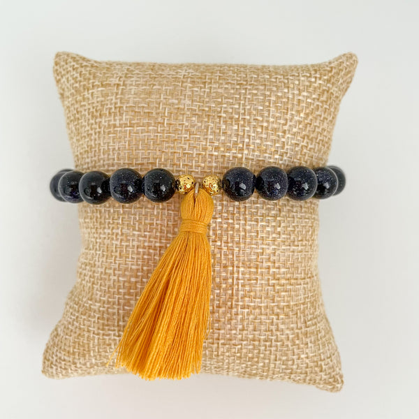handmade goldstone tassel bracelet with yello tassel