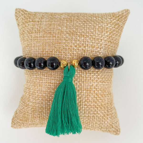 handmade goldstone tassel bracelet with kelly green tassel