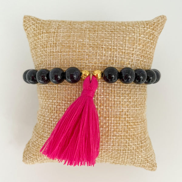 handmade goldstone tassel bracelet with hot pink tassel